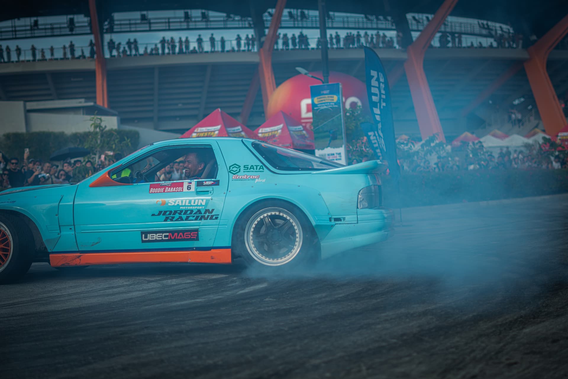 RX-7 sideways at stadium
